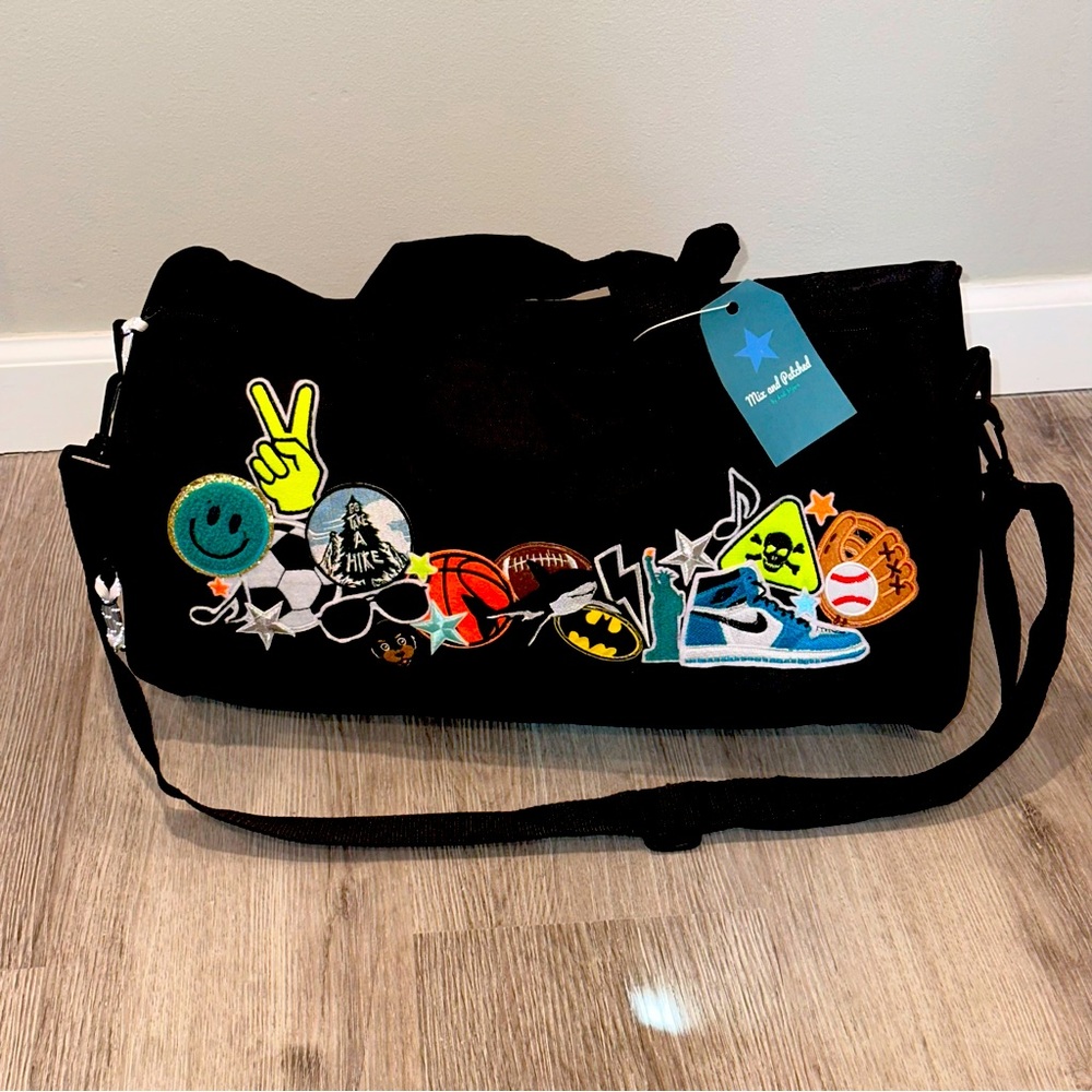 NWT Kids duffle bag with embroidery patches. Black.